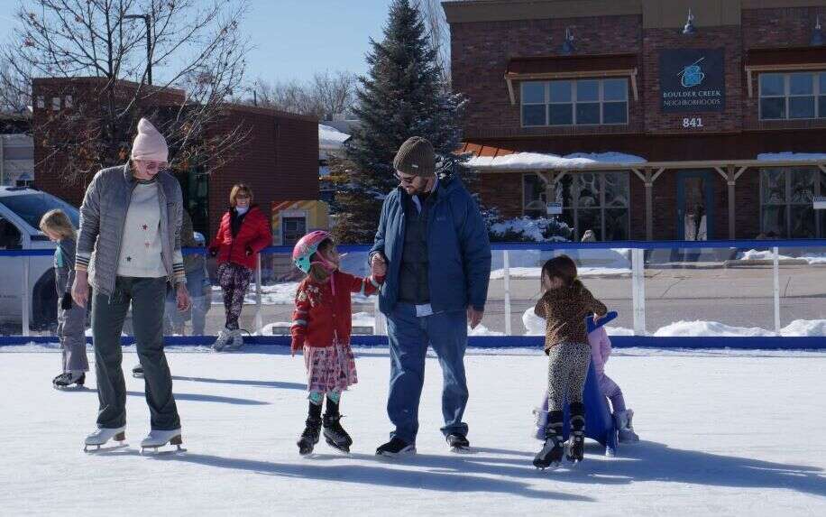 Family enjoying an ice rink rental by Jump Around Party Rentals Family enjoying an ice rink rental by Jump Around Party Rentals