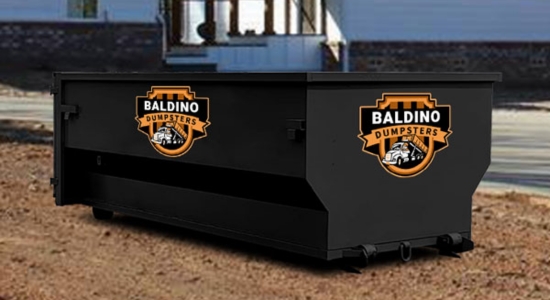 Baldino Dumpsters roll-off bin positioned near a residential property