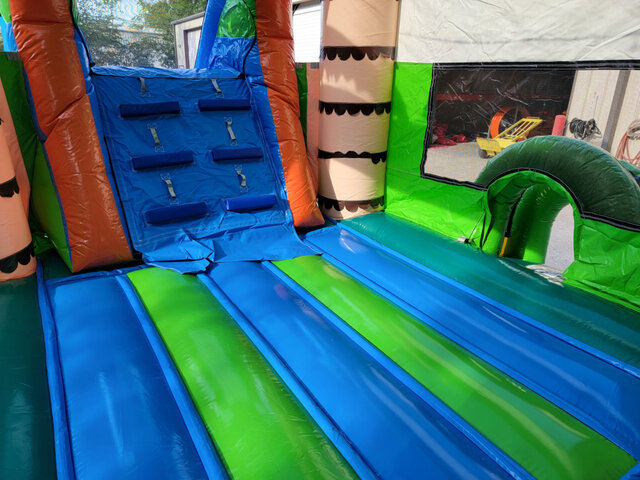 Tiki Island Bounce House area with ladder for slide
