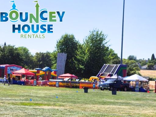 Bouncey House Rentals corporate event setup in Sacramento with inflatable attractions, tents, and entertainment for a company picnic