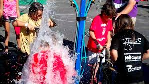 Hydro Blasters 4-station water balloon pump game in action at a Sacramento event from Bouncey House Rentals