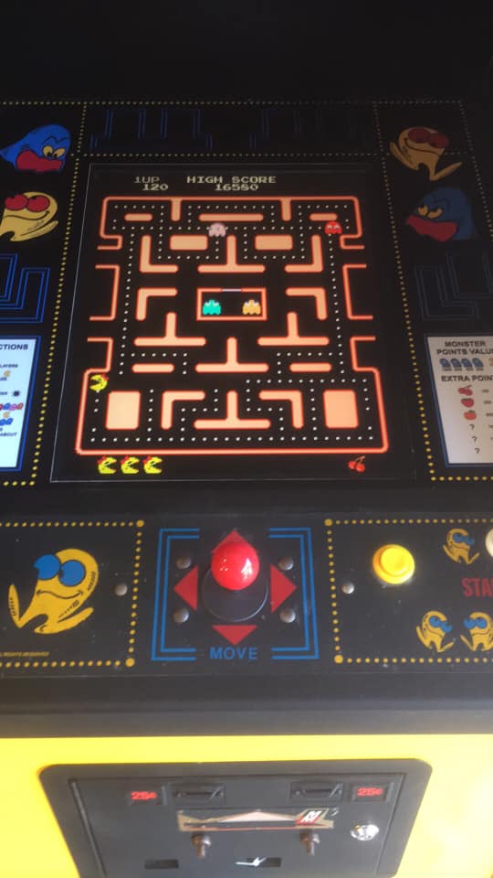 Pac-Man Arcade Game rental cabinet graphics from Bouncey House Rentals in Sacramento, CA
