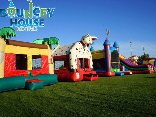 School event rentals in Sacramento from Bouncey House Rentals with bounce houses and inflatables set up on a school campus for field day
