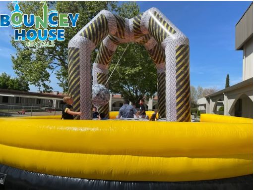 Wrecking ball inflatable game rental for school field days and campus events in Sacramento from Bouncey House Rentals