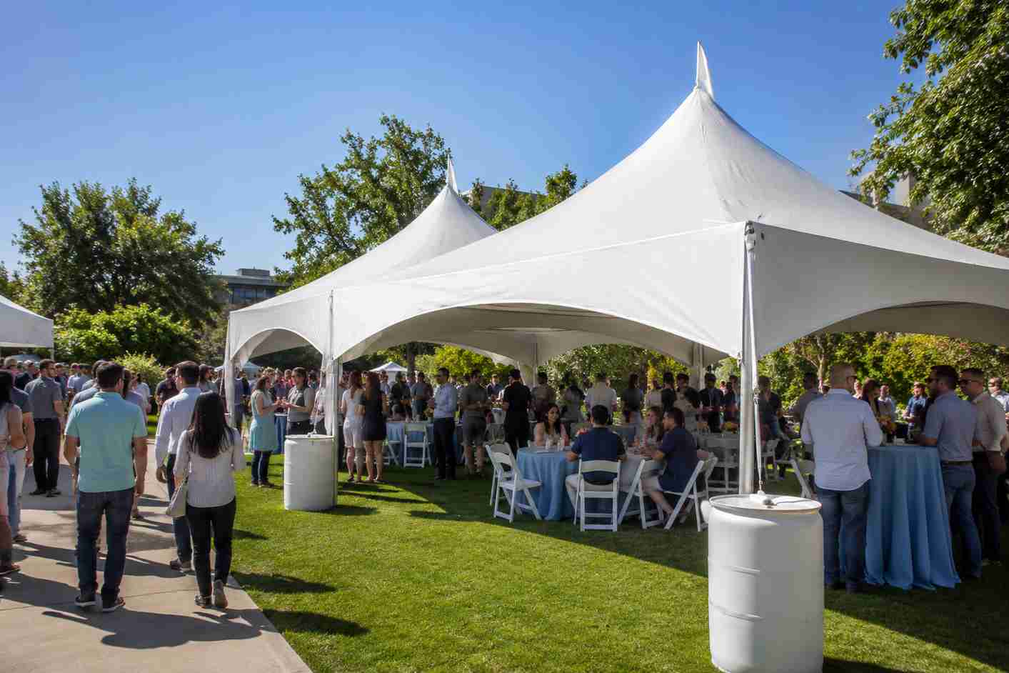 High peak tent rental in Rocklin, CA from Bouncey House Rentals, peaked-roof event tent set up for an outdoor celebration