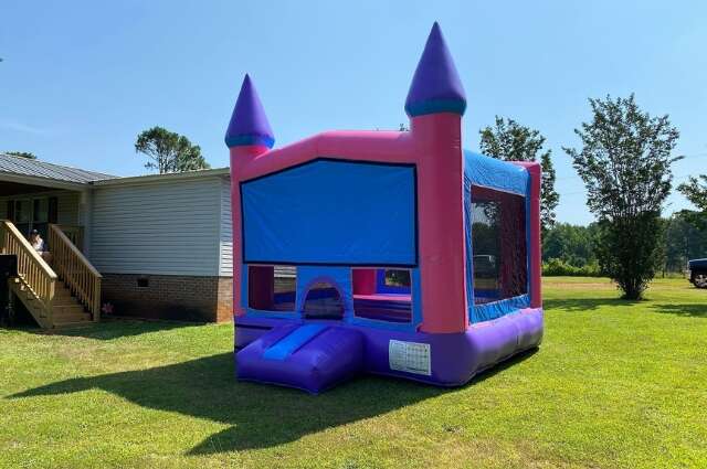 Pink and purple castle bounce house from Big Bounce Party Rentals