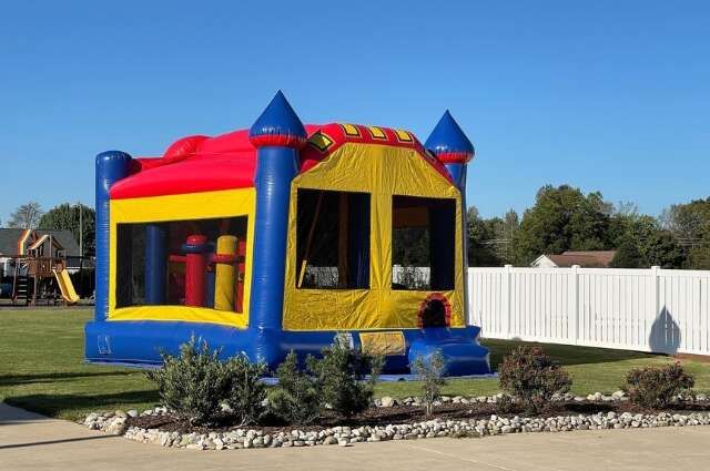 Yellow and red commercial bounce house from Big Bounce Party Rentals
