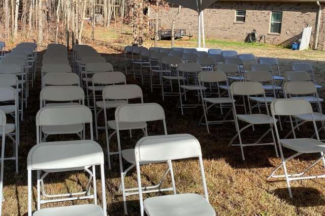 Rows of white folding chairs arranged for event from Big Bounce Party Rentals