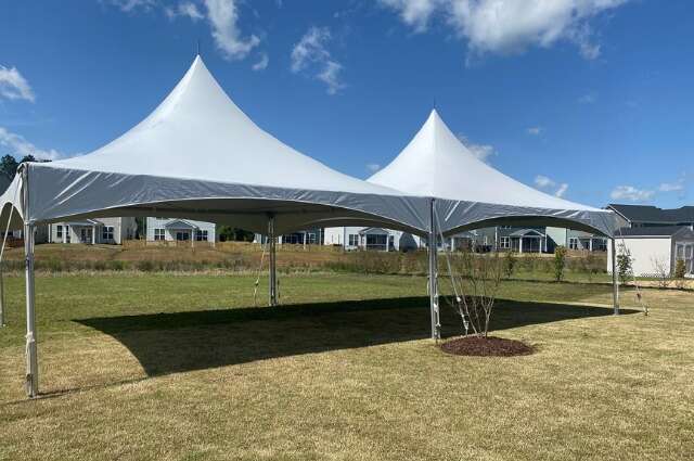 White party tent set up on grass from Big Bounce Party Rentals