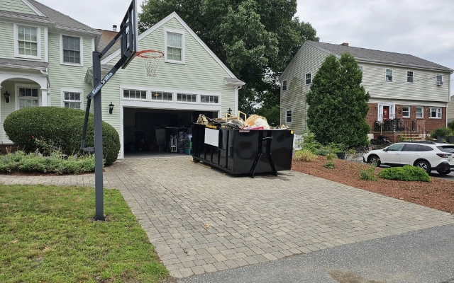 Big Foot Dumpsters container in a residential driveway