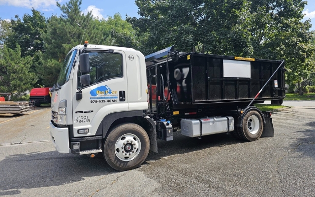 Big Foot Dumpsters truck with dumpster on site