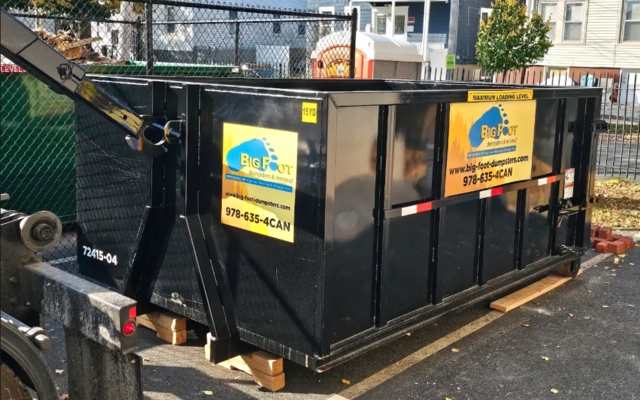 Big Foot Dumpsters container beside a house