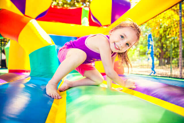 Child playing inside bounce house