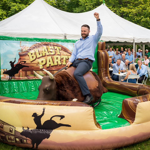 Mechanical bull rental at corporate company picnic in Southern Maine and Seacoast New Hampshire by Blast Party Rentals