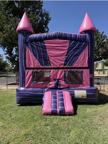 PURPLE AND PINK BOUNCE HOUSE