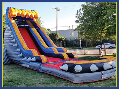 Angled view of the water slide, designed with three dimensional spikes around the outside.