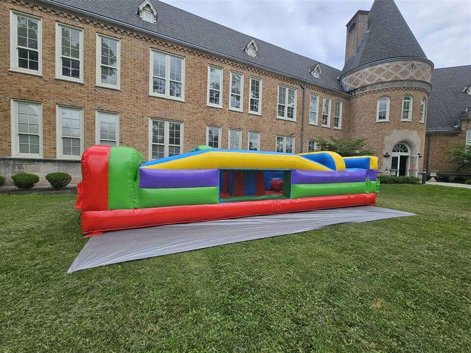 Retro inflatable obstacle course set up on the lawn at Mt. Washington School in Cincinnati