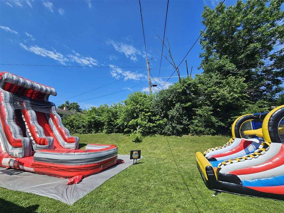 Red Lava Wave inflatable water slide set up in a backyard near Delhi, Ohio
