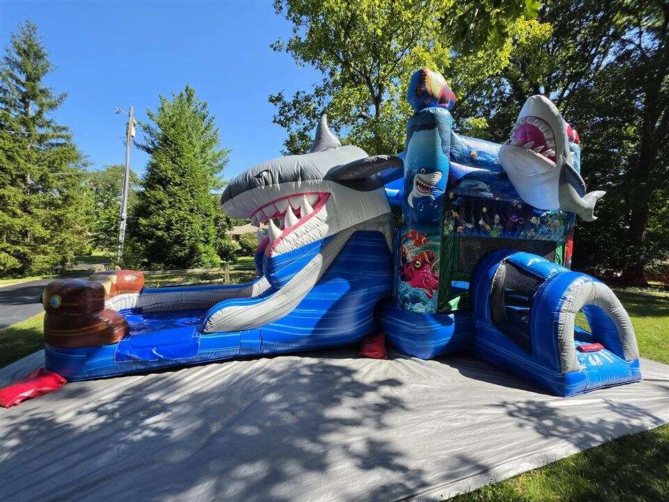 Shark Attack bounce house and slide combo set up on a driveway in Madeira, Ohio