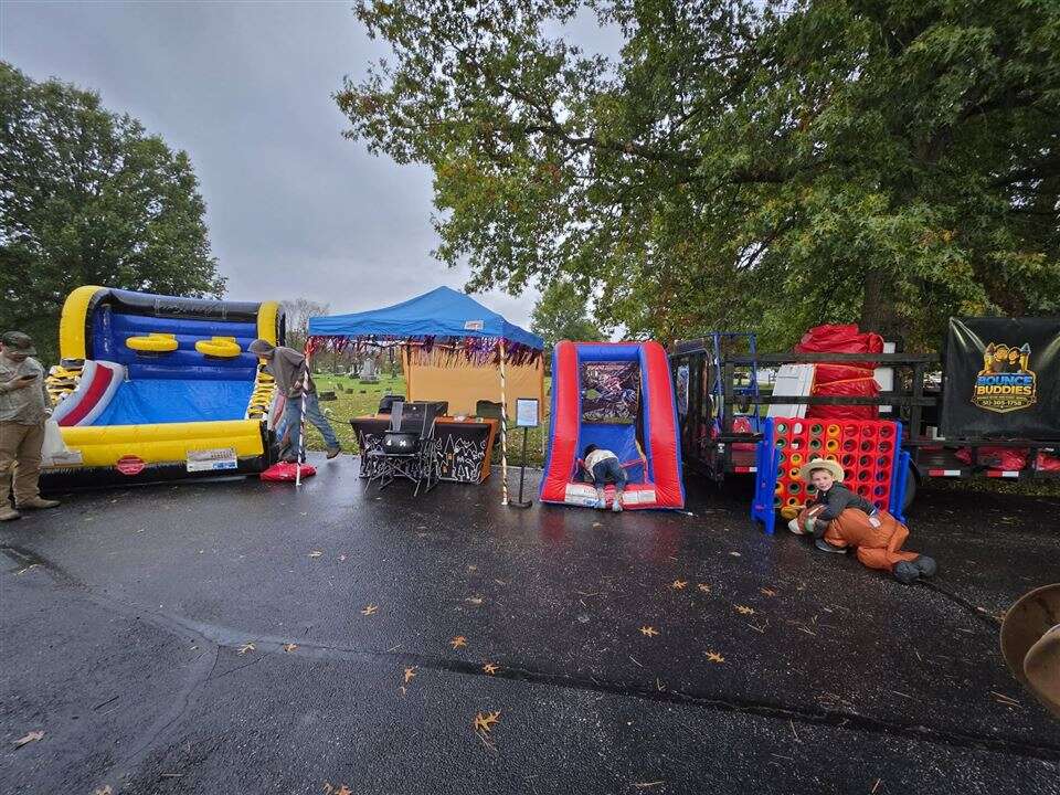Hoop Shot basketball, inflatable games and giant 4-to-score set up at St. Louis School's Trunk or Treat in Owensville, Ohio