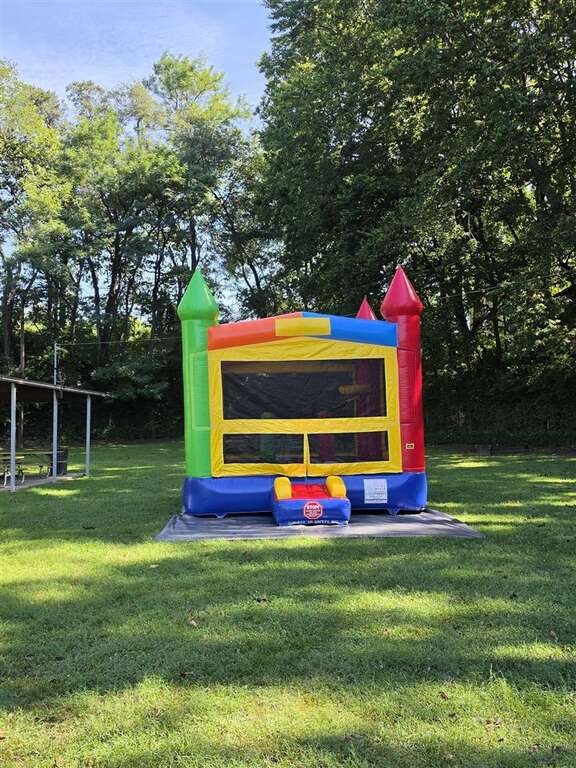 Rainbow castle bounce house set up at Ross Park in St. Bernard, next to Norwood