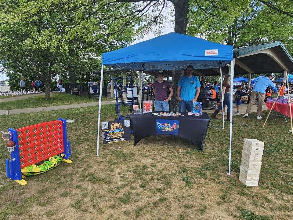 Bounce Buddies booth with giant 4-to-score and giant tumbling towers at the Walk the Spectrum autism awareness walk at Veterans Park