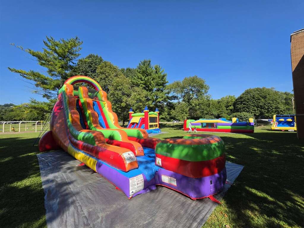 Tropical water slide and inflatables set up for an event at Lunken Playfield in Cincinnati