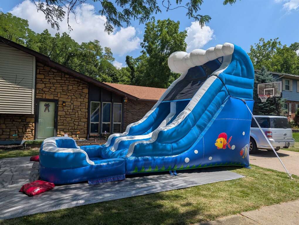 Blue wave inflatable water slide set up in a front yard in Fairfield, Ohio
