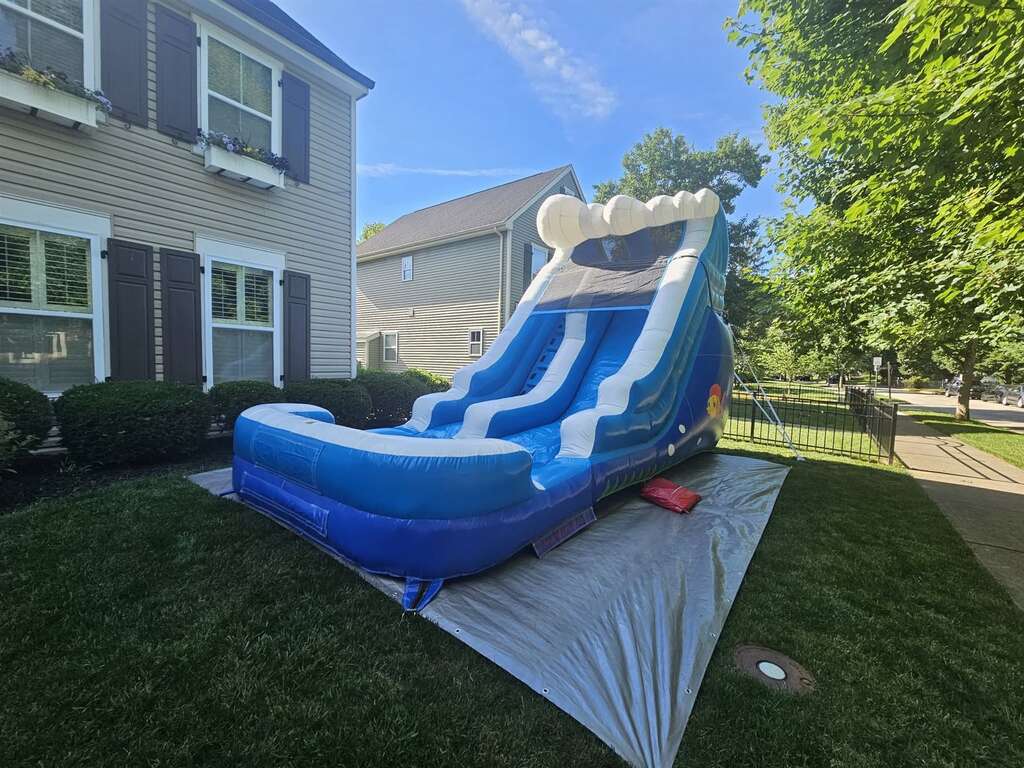Blue wave inflatable water slide set up in a yard in Mariemont, Ohio