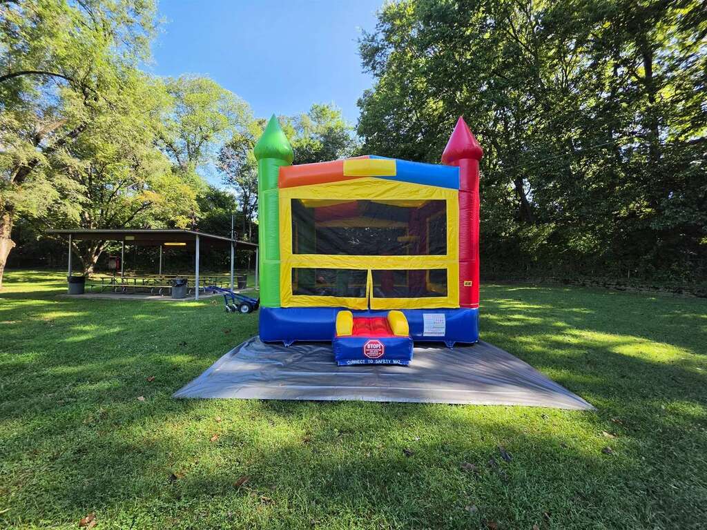 Colorful castle bounce house set up in a park near Norwood, Ohio