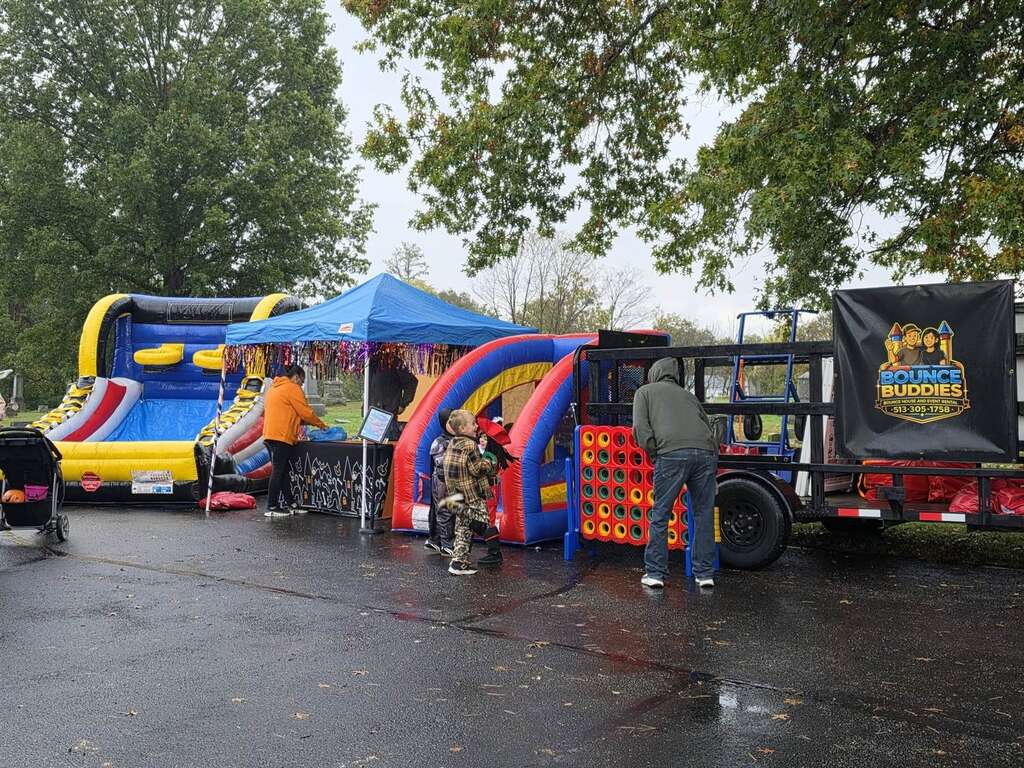 Inflatable games and the Bounce Buddies booth at St. Louis School's Trunk or Treat in Owensville, Ohio