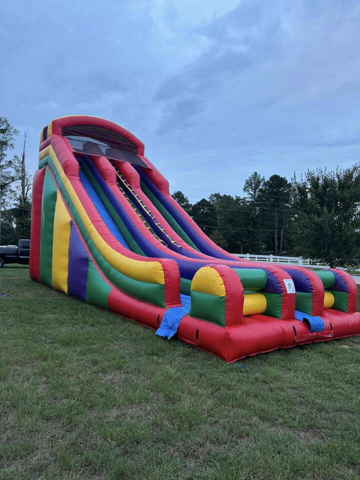 Colorful inflatable castle with slide from Bounce-E-Roo Rentals Colorful inflatable castle with slide from Bounce-E-Roo Rentals