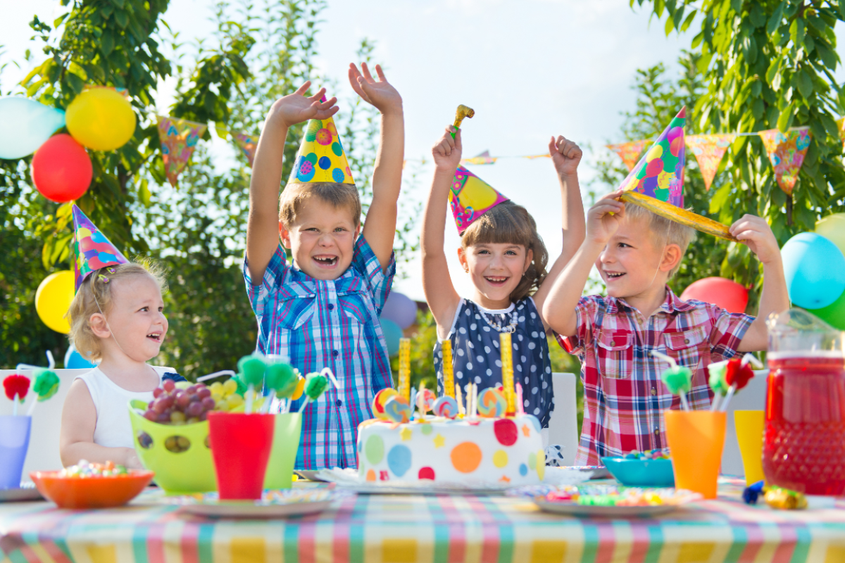 Happy kids celebrating at a Bounce-E-Roo Rentals event Happy kids celebrating at a Bounce-E-Roo Rentals event