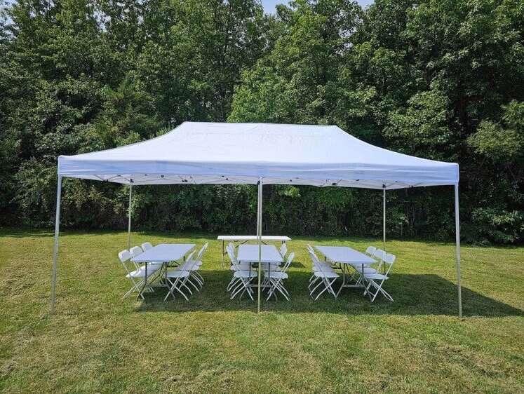 Tent, chairs, and tables set up for an event by Bounce-E-Roo Rentals Tent, chairs, and tables set up for an event by Bounce-E-Roo Rentals