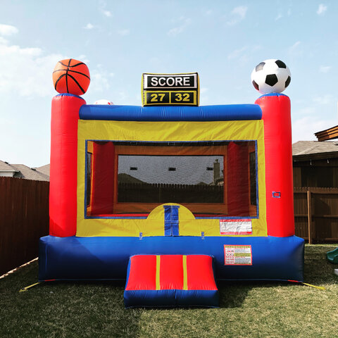 15' X 15' Inflatable sports arena bounce house on grass in backyard.