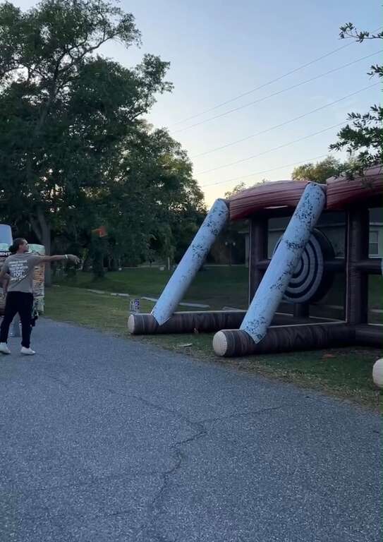 Inflatable axe throwing game set up at a church youth event in Saint Cloud, FL