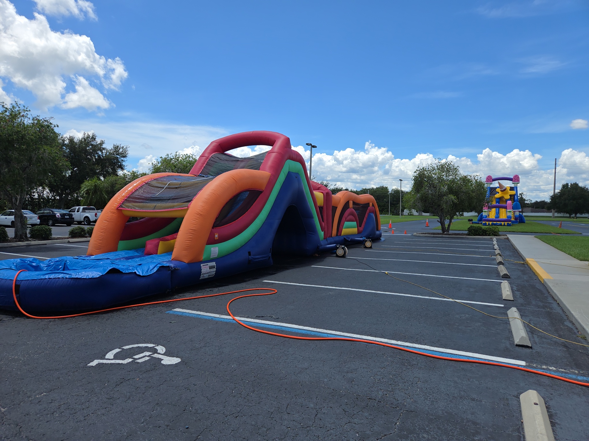 Inflatable obstacle course set up on a parking lot for an organization event