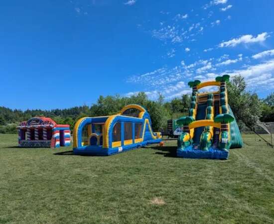 Bounce-N-Battle inflatable rentals set up outdoors for a community event