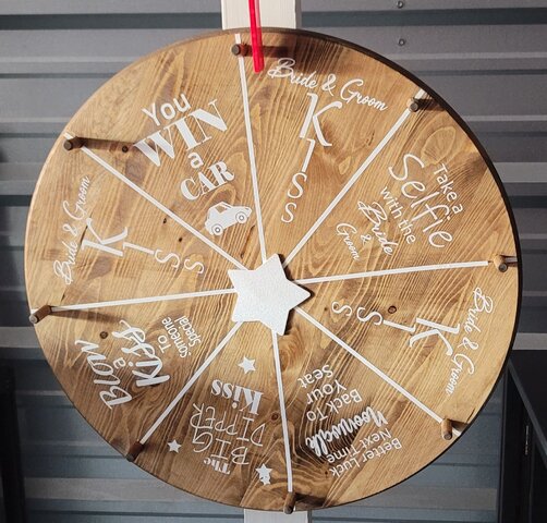 Fun rustic wedding prize wheel