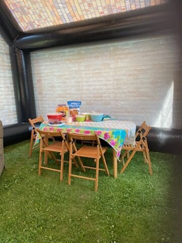 Table set up in small inflatable pub