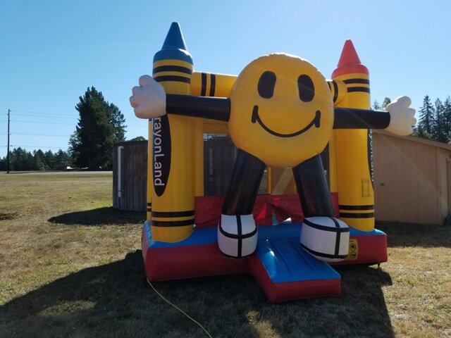 Happy face bounce house rental