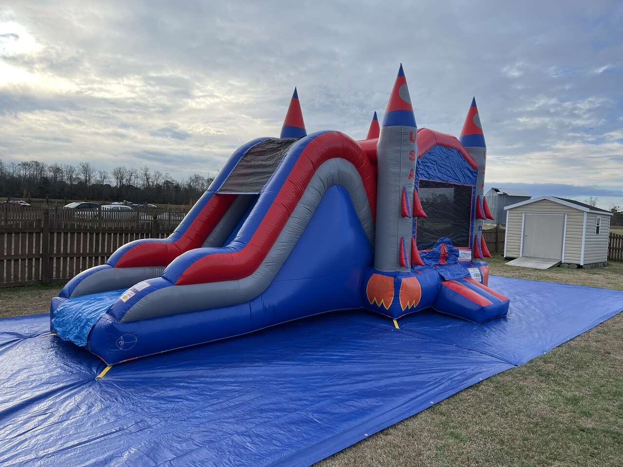 Bounce House inflatable with slide shaped like rockets