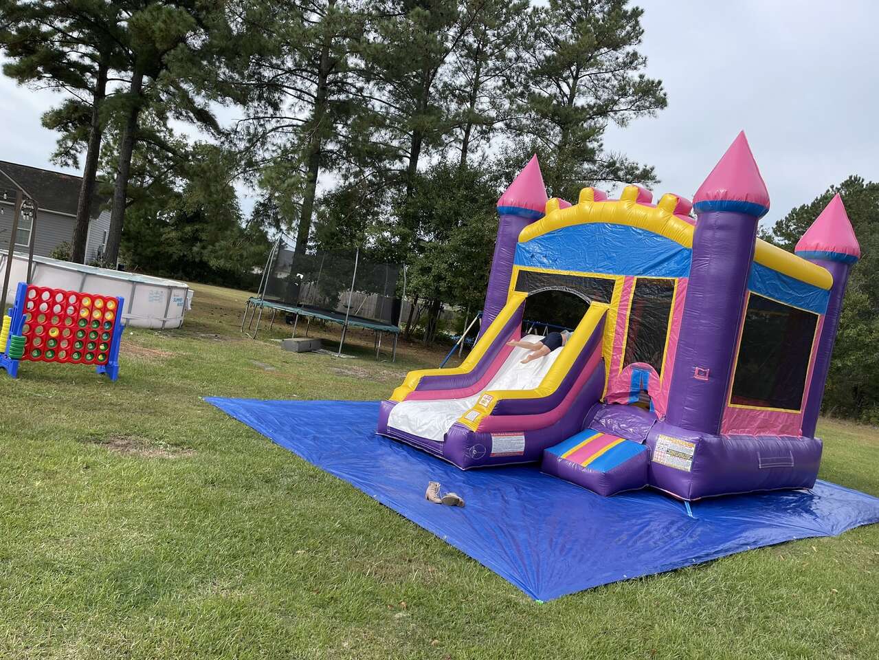 Purple Bounce house with a slide