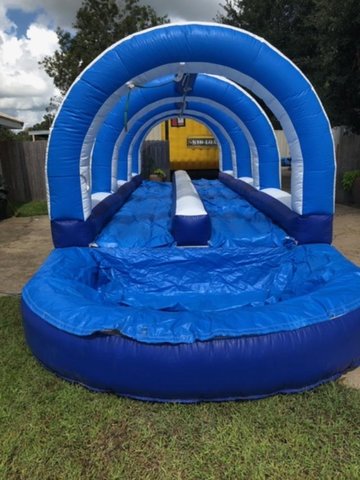 A Double Lane Slip N Slide With Pool