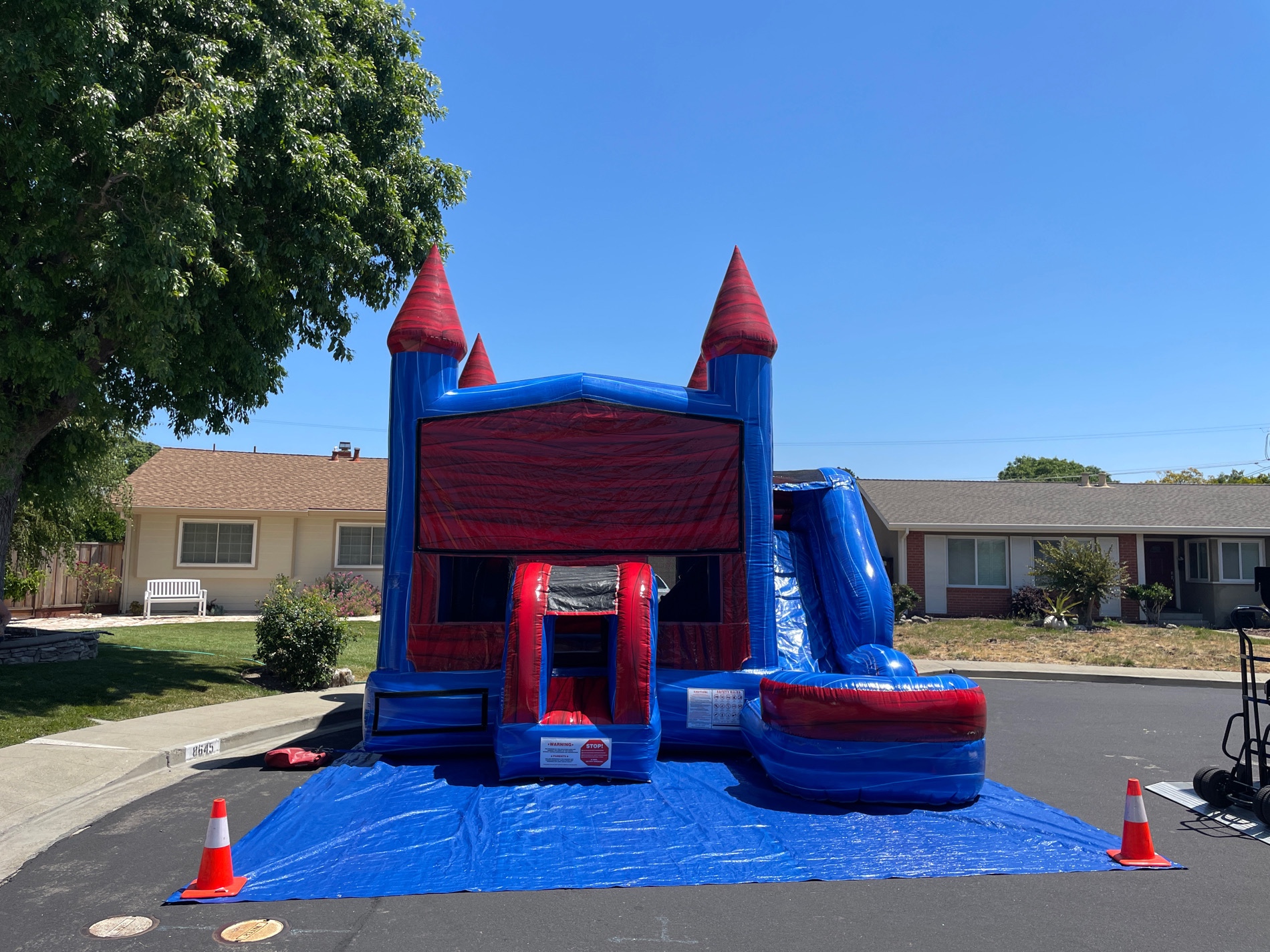 6-in-1 Combo Slide bounce house, red and blue castle theme with slide