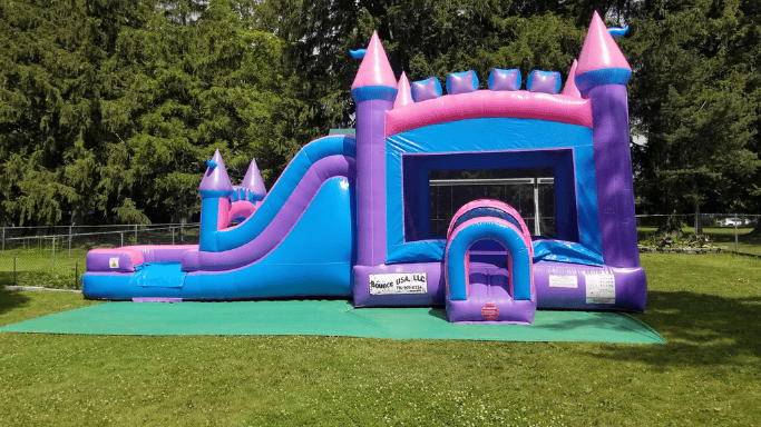 Blue dunk tank with a clear see through window set up for a school event at the end of the year