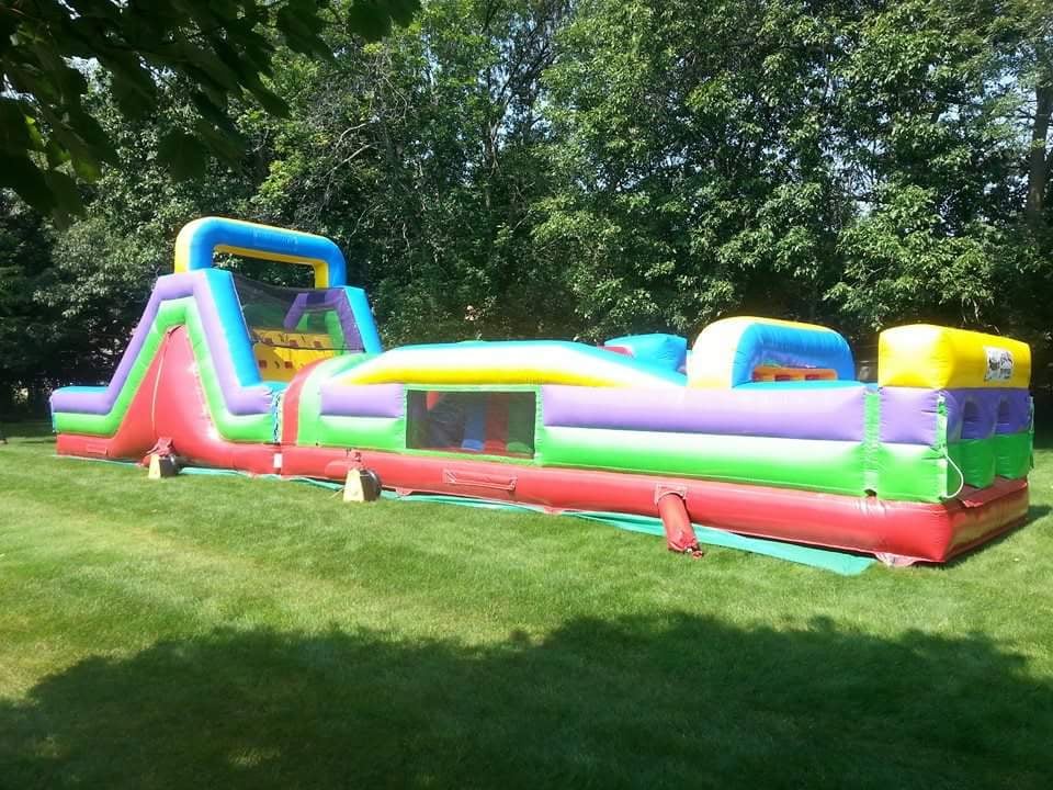 Multi colored 2 piece 60 foot obstacle course for a graduation party