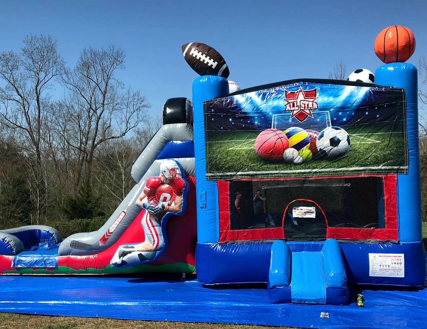 Bounce USA set up a sports bounce house with a slide for a birthday party