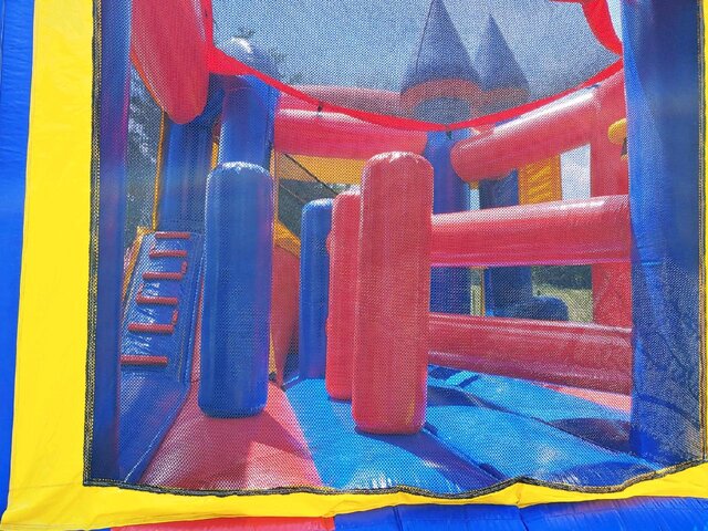 Large bounce house inflatable jumping castle with obstacles and slide