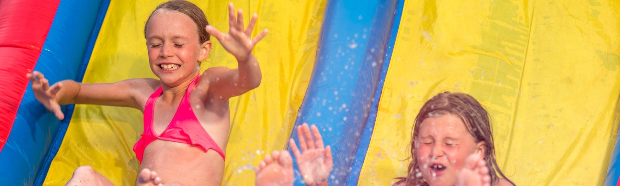 kids enjoying water slide